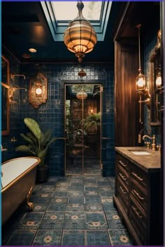 a bathroom with blue tiles and gold fixtures on the walls, along with a bathtub