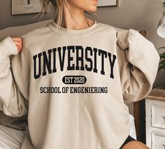 🎅LAST DAYS FOR CHRISTMAS DELIVERY.🎅 USA →  12/12/2023  CANADA → 12/12/2023 EUROPE →  12/12/2023 Custom College Sweatshirt, Personalized College Sweater, Customized School Sweatshirt, Custom Pullover, University Hoodie, College Program Each sweater is printed on order with love ❤ This sweater essential fits like a well-loved favorite. The excellent quality print makes one to fall in love with it over and over again. Size chart available in photo. Any questions? Just ask :) Want to personalise something? Just drop me a line... Halloween Town Movie, Silly Goose University, Halloweentown University, College Sweater, University Hoodie, School Sweatshirts, University Shirt, Christmas T Shirt Design, Silly Goose