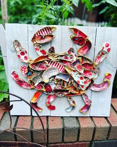 this is an image of a crab made out of scrap wood and other things on it