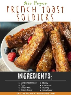 french toast soldiers on a white plate with berries and powdered sugar in the middle