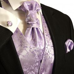 a man wearing a suit and purple tie