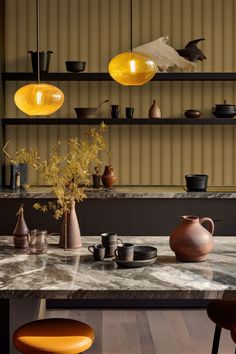 a table with some vases and bowls on it