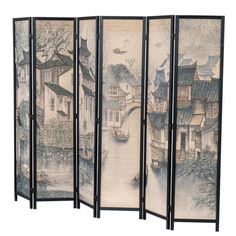 This freestanding 6-panel room divider adds a sense of tranquility (and a little bit of privacy) to larger spaces. The woven bamboo surface of all six panels depicts a classic print of a small canal town using traditional black and blue inks, with house rooftops that call to mind ancient villages in eastern Asia. A solid pine wood frame brings extra durability - and each panel is connected by hinges, so it's easy to fold up when you want to tuck it away. It measures a bit under 6' tall and stret Privacy Partition, Black Ink Art, Folding Room Divider, Work Cubicle, Bamboo Room Divider, Wooden Room Dividers, Bamboo Panels, Asian Architecture, Folding Room Dividers