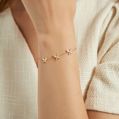 "Let your dazzling style transform the crowd with Mery's CZ Triple Butterfly Bracelet, featuring a trio of cute butterfly pendants that are embellished in sparkling CZ stones and sit daintily on a delicate chain. Pair this gem with a couple of charm bracelets and an elegant midi dress for a lovely look that can work night or day. ❥ Why choose me ? * It's dainty and can be worn every day * A special piece you'll treasure * High quality materials and attention to detail * This bracelet is hypoalle Cute Girly Accessories, Butterfly Bracelet Gold, Simplistic Jewelry, Bracelet For Women Gold, Delicate Gold Bracelet, Gold Bracelet Simple, Bracelet Layering, Pretty Jewelry Necklaces, Personalized Leather Bracelet