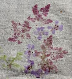 an old piece of paper with flowers on it