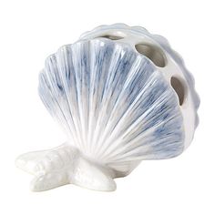 Decorate your bathroom oasis with the beautiful coastal flair of the Avanti abstract coastal toothbrush holder. The figural ceramic piece features a fan shell design sitting on a starfish base with hand-painted detailing in blue and beige brushstrokes.Included: 1 Toothbrush Holder(s)Features: Ridge(s)Measurements: 4.25 Height/Inches, 3.39 Width/Inches, 5.16 Length/InchesBase Material: 100% CeramicCare: Wipe CleanDecor Styles: CoastalHome Accessories Type: Toothbrush HoldersCountry of Origin: Imp Coastal Shower Curtain, Ceramic Toothbrush Holder, Beachy Room, Bathroom Oasis, Beach Icon, Beach Room, Coastal Bathrooms, Shell Design, Beach Bathrooms