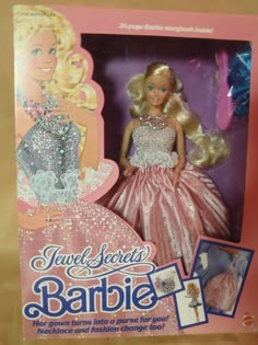 the barbie doll is in its pink box