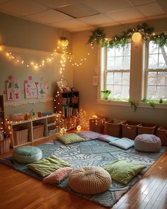 a room with lots of lights and pillows on the floor