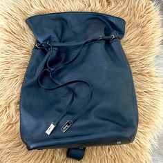 Brand New, Incredible Condition! All Black Leather With Silver Accents. Fully Authentic, Tag Included. One Strap Drawstring Bag. Comes With A Matching Built-In Pouch. Timeless Style! Bags Ysl, Ysl Tote, Ysl Clutch, Ysl Handbags, Leather Drawstring Bags, Saint Laurent Bags, Ysl Beauty, Yves Saint Laurent Bags, Saint Laurent Bag