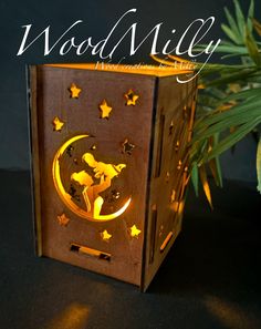 a wooden box with the words wood milly on it and stars in the background