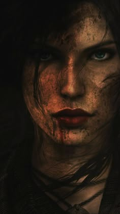 a woman with blue eyes and blood on her face