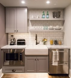 the kitchen is clean and ready for us to use it's stainless steel appliances