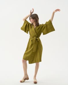 "Midi linen kimono robe -- wear it as a wrap dress, or as a lush cardigan. Offered in medium-weight and exclusive linen. If you're interested in short & long options, check our robes SUNRISE & NOON. STYLE DETAILS * Loose fit * Kimono collar & sleeves * Belt included * With pockets * Above-the-knee length * Made from medium-weight and exclusive linen SIZES & COLORS IN THE PICTURES * Model is wearing a size S/M in Olive Green (medium) linen Model's height - 174 cm (5' 8\"), bust - 80 cm (31.5\"), Beach Wrap Linen Dress, Long Linen Kimono For Summer, Relaxed Fit Linen Robe For Spring, Spring Wrap Robe With Relaxed Fit, Linen Kimono With Kimono Sleeves For Vacation, Long Linen Robe For Spring, Beach Linen Wrap Dress, Spring Linen Wrap Dress, Linen Wrap Kimono For Vacation