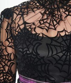 A darling 1960s style high-neck blouse crafted in a lightweight sheer black boasting black flocked spiderwebs throughout. Complete with a ruffle trim on the front, shoulders and neck.Cami Sold SeparatelyAvailable in sizes XS-5X while supplies last. Haunted Cottagecore, Spiderweb Fashion, Spooky Fits, Long Sleeve Under Shirt, Halloween Chic, Up Halloween Costumes, Uv Clothing, Gothic Themes, Tim Burton Style