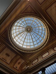 a domed glass ceiling in the center of a room