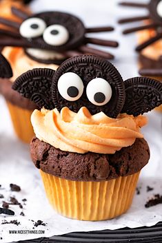 chocolate cupcakes decorated with oreo cookies and googly eyes are ready to be eaten