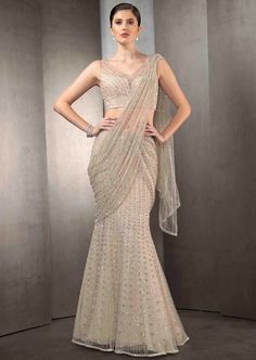 Draped pre-stitched tulle sari embellished with tonal embroidery with matching embroidered blouse. Saree Dress Design Ideas, Reception Saree Look, Indian Wedding Reception Outfits, Saree Gowns, Rahul Khanna, Lehenga Saree Design, Wedding Lehenga Designs, Latest Dress Design, Drape Gowns