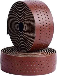 two rolls of brown leather with holes on the side and one roll is rolled up