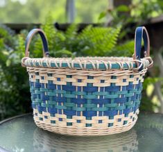 a blue and white basket sitting on top of a table