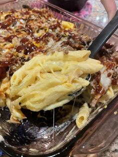 a casserole dish with noodles, meat and cheese