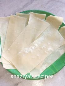 four pieces of ravioli on a green and white plate with the words shazzya recipes written across it