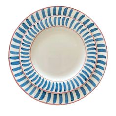 three blue and white plates with stripes on them