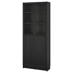 a black bookcase with glass doors on the front and bottom shelves, against a white background