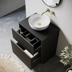 a bathroom with a sink, mirror and rug on the floor in front of it