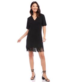 Stand out in this versatile, comfortable dress made from a lush curtain of fringe details with stretch jersey knit. This dress can easily transition from brunch to dinner with a simple switch of shoes and accessories. Short sleeves Length: 37 1/8 inches (size MP) 90% Rayon, 10% Spandex Made in USA Machine wash cold separately V-neckline Fringed hem | Karen Kane Petite Size V-Neck Fringe Dress in Black, Size LP, Plain, Rayon/Spandex Casual V-neck Dress With Fringe, Casual V-neck Fringe Dresses, Casual Short Sleeve Dress With Fringe, Bohemian Chic Outfits, Black Dress Style, Fringe Shirt, Short Dress Styles, Karen Kane, Fringe Dress