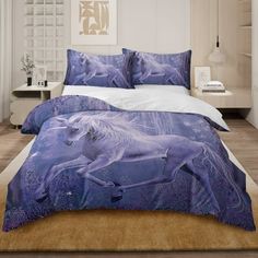 a bed room with a large white horse on it's cover and pillow cases