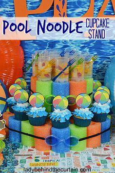 there are many cupcakes on display at this pool noodle birthday cake stand