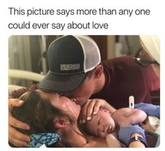 a man and woman kissing each other while laying in bed with the caption reads, this picture says more than anyone could ever say about love