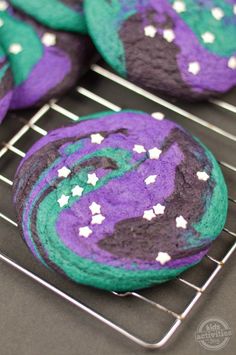 a close up of a cookie on a rack with the words galaxy sugar cookies above it