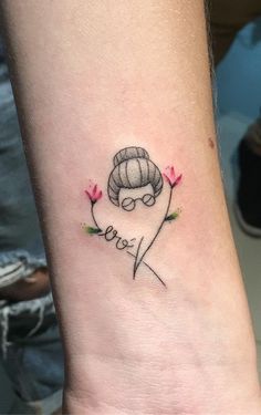 a woman's wrist tattoo with the word love on it