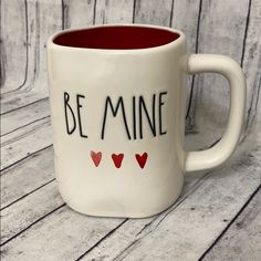 a coffee mug with the words be mine written on it