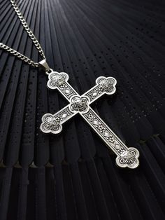 Embrace the cyberpunk, gothic, steampunk, and retro vibes with our unique cross necklace. This single necklace captures the essence of multiple alternative fashion styles, making it a versatile and edgy accessory. Add a touch of mystery and individuality to your look with this statement piece.   Please note that this product includes only the necklace. Spiritual Metal Cross Necklace, Punk Style Metal Cross Jewelry, Handmade Punk Style Cross Jewelry, Gothic Metal Cross Necklaces, Vintage Metal Crucifix Cross Necklace, Punk Style Silver Cross Pendant Jewelry, Vintage Metal Cross Necklace, Gothic Cross Necklace Gift, Gothic Stainless Steel Cross Necklace