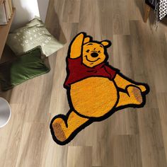 a winnie the pooh rug is on the floor