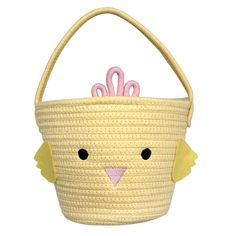 a woven basket with a pink bow on the top and a yellow bird in the bottom