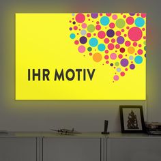 a yellow sign that says h r motivv on the side of a wall