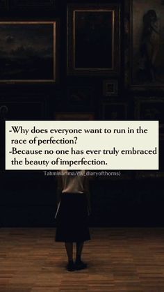 a woman standing in front of paintings with a quote on it that reads why does everyone want to run in the race of perfection