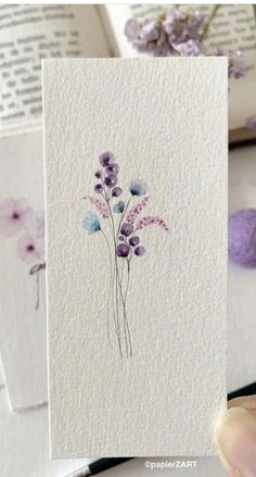 some cards with watercolor flowers on them