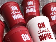 several red cups with white lids that say on cloud wine