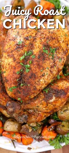 juicy roast chicken on a platter with carrots, potatoes and parsley sprigs