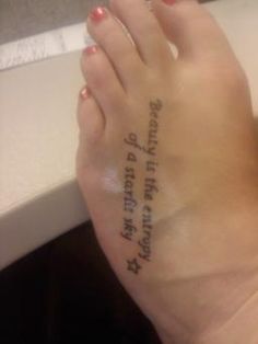 a woman's foot with writing on it