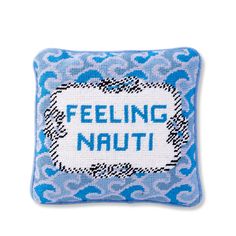 a blue pillow with the words feeling natti on it