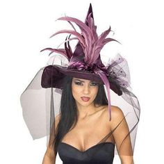 a woman wearing a purple hat with feathers