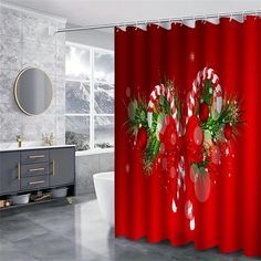 a christmas themed shower curtain with candy canes and greenery on the red background