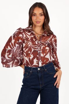 DETAILS    Make a lasting impression with this stunning blouse! This soft sheer top features a collared V neckline and long sleeves with button cuff closure. A functional row of buttons down the front ensures an effortlessly chic look.   soft sheer blouse  v neckline  long sleeves with button close  functional buttons down front  tropical print  relaxed fit  unlined   material - 100% polyester     SIZING     model is 5' 6" and wears a Size XS    model stats: bust - 31", waist - 23", hips - 34" Chic Look, Sheer Top, Sheer Blouse, Tropical Print, The Row, Long Sleeves, Relaxed Fit, Long Sleeve, How To Wear