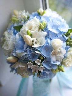 a bouquet of blue and white flowers