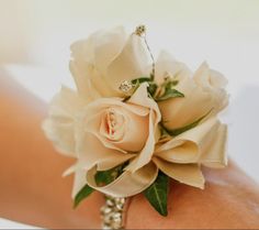 a close up of a person's wrist with a flower on it